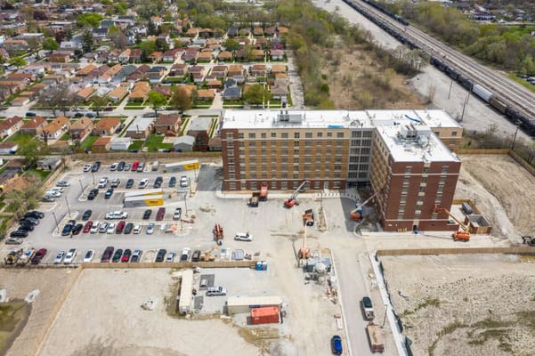 Aerial photograph of The Montclare Senior Residences with parking and surrounding neighborhood.