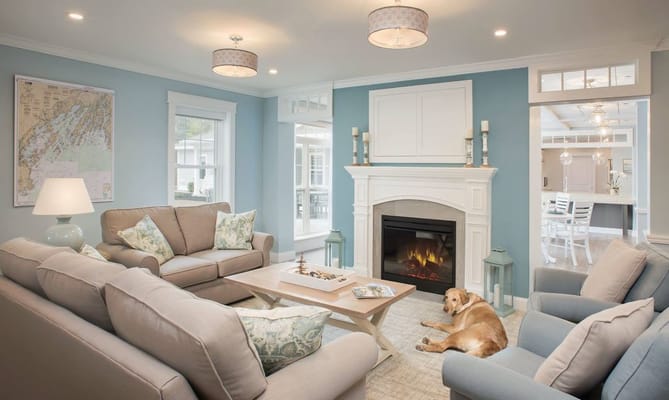 Bright and inviting lounge area with seating and a fireplace