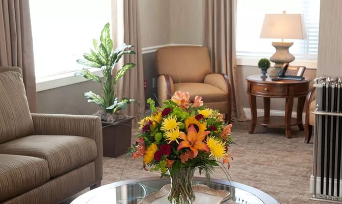 Living room with a floral arrangement and comfortable seating