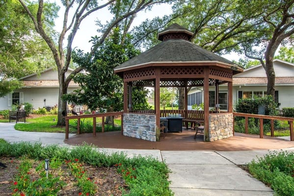 Covered gazebo surrounded by greenery