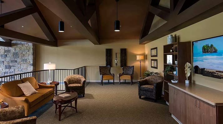 Spacious living room with comfortable seating and decor.