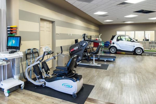 Exercise machines in a well-lit room