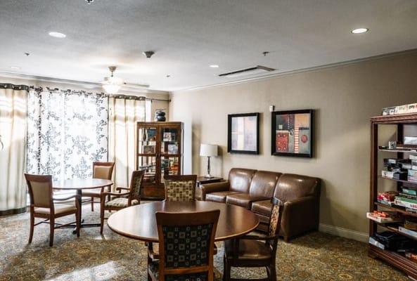 Bright common area with seating and bookshelves