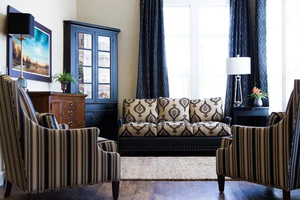Inviting living room with patterned sofa and armchairs