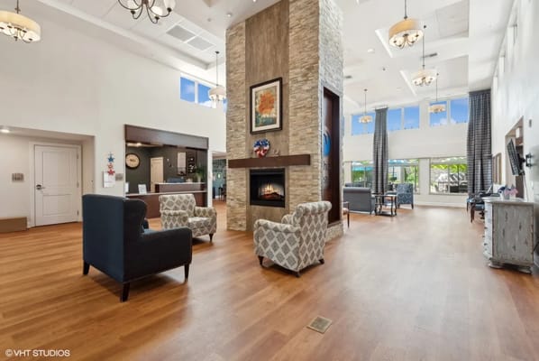 Modern lobby with seating and a fireplace
