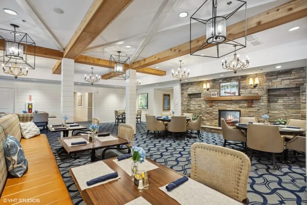 Cozy dining area with tables and fireplace
