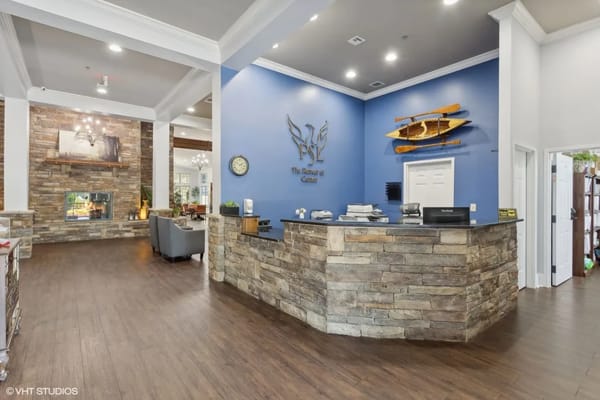 Welcoming reception area with a stone counter and modern decor.