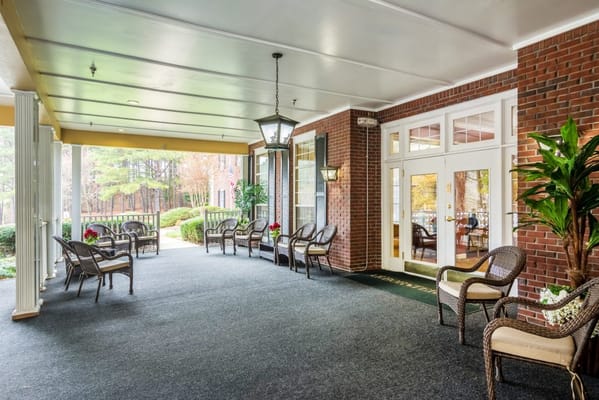 Covered porch area with seating at The Retreat at Cascade