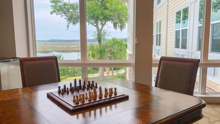 Interior space with a chess board and large windows
