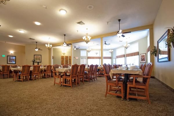 Dining room with tables and chairs in a facility