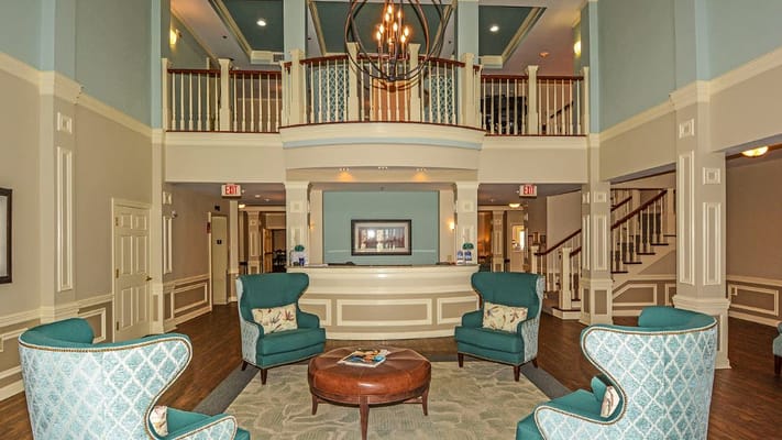 Bright and spacious lobby with stylish seating and a reception desk