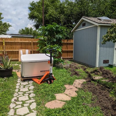 Generator and pathway in a garden area