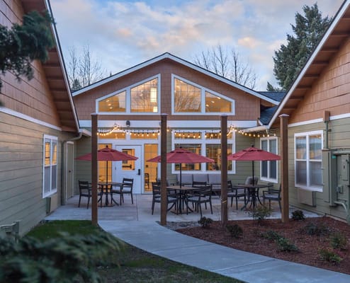 Outdoor patio area with seating and umbrellas