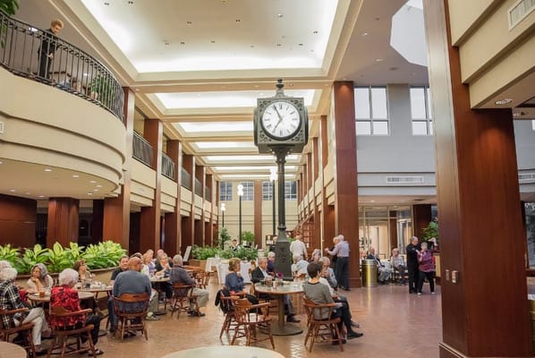 Residents enjoying meals in a common dining area