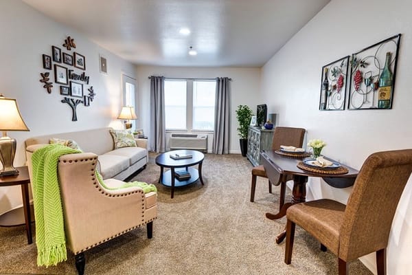 Bright and inviting living room with comfortable seating and decorative accents.