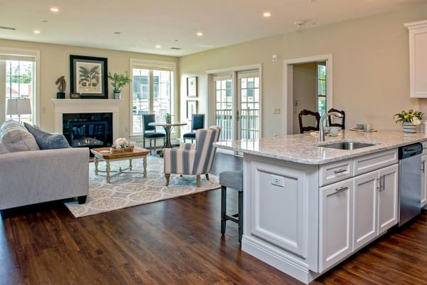 Cozy living room with a fireplace and dining area.