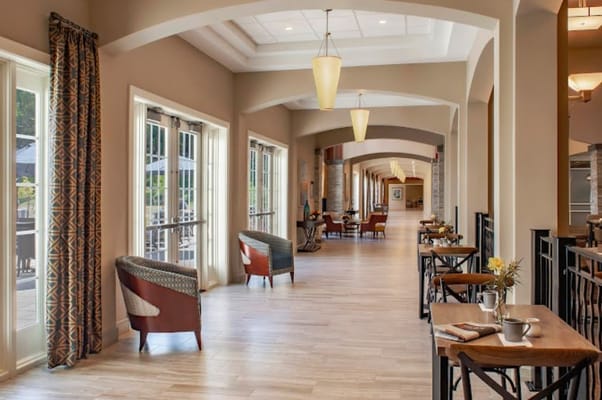 Stylish lobby space with seating and tables at The Vista