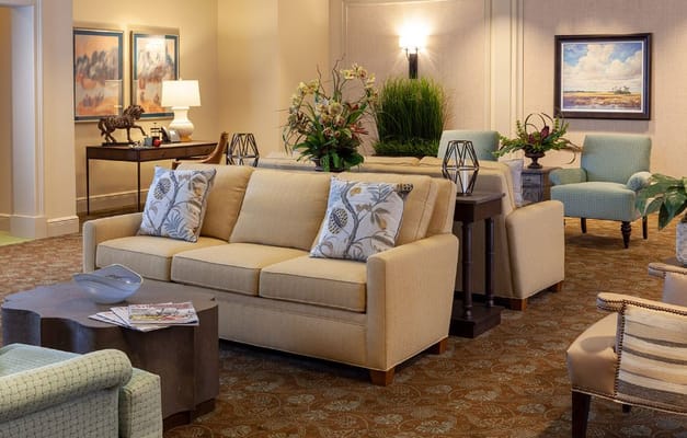 Comfortable lounge area with soft seating and decorative plants