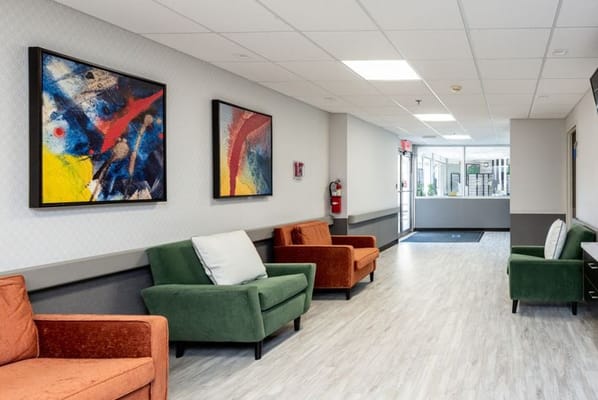 Bright hallway with artwork and seating