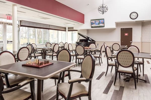 Bright common area with tables and chairs