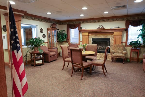 Cozy lounge area with seating and fireplace