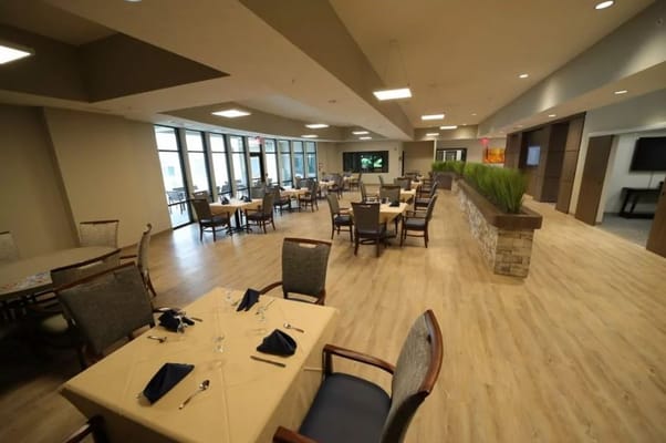 Dining area with tables set for residents