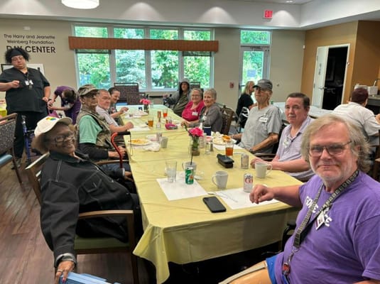 Residents enjoying a meal together in the dining area