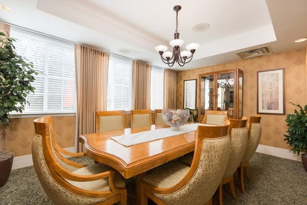Spacious dining room with a large wooden table and comfortable seating