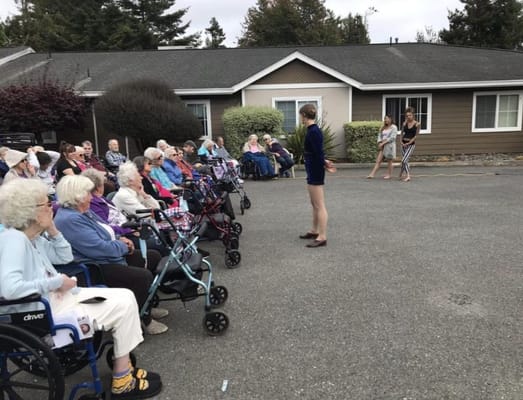 Residents enjoying an outdoor performance event