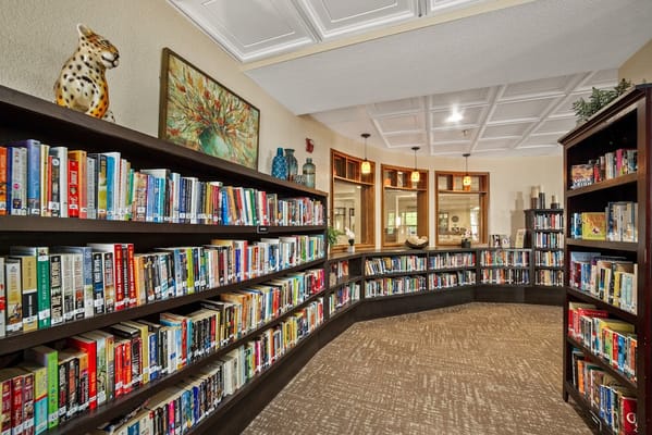 Cozy library with bookshelves and comfortable seating