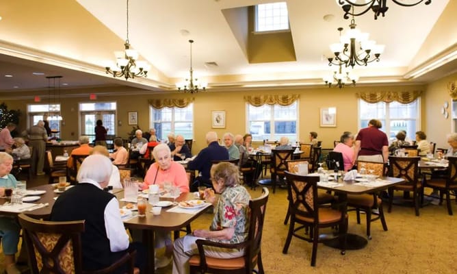 Residents enjoying a meal in the dining room