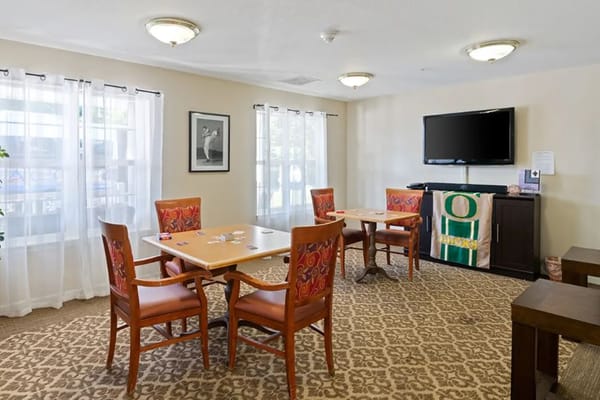 Spacious common area with tables and chairs
