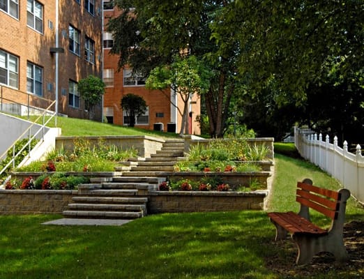 Well-maintained garden area with steps and seating