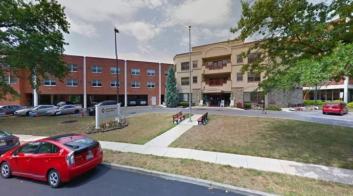 Exterior view of the facility with parking area