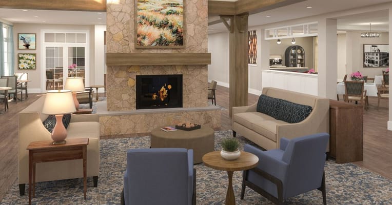 Interior lobby area with seating and fireplace