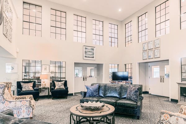 Spacious and elegant lobby with modern seating and large windows