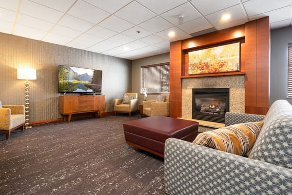 Cozy common area with comfortable seating and a fireplace