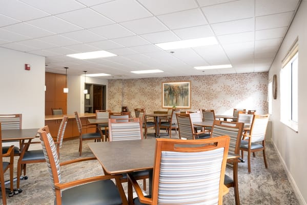Bright common area with tables and chairs