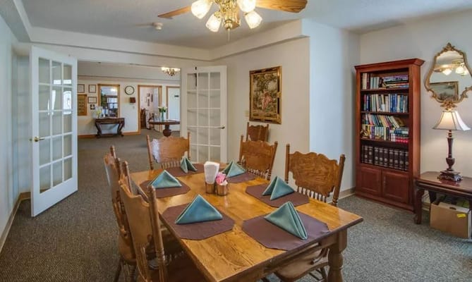 Cozy dining room setup with wooden table and chairs