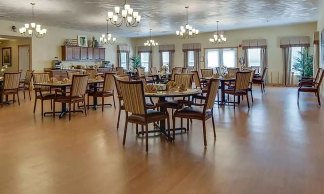 Spacious dining room with tables set for meals