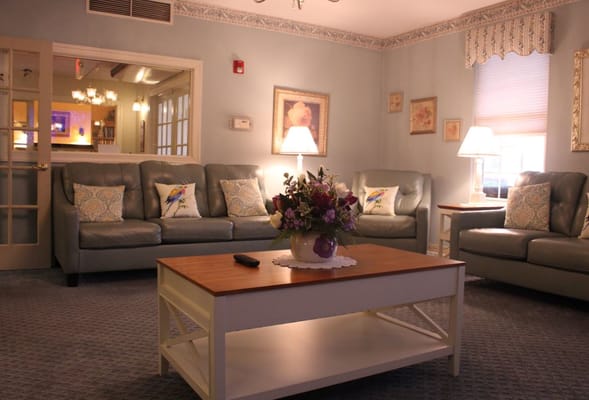 A cozy common area with comfortable seating and decor