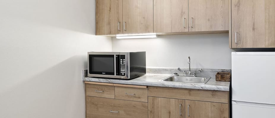Compact kitchenette with microwave and sink