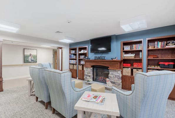 Cozy common area with comfortable seating and bookshelves