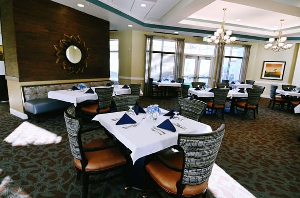 Beautifully arranged dining room with tables and chairs