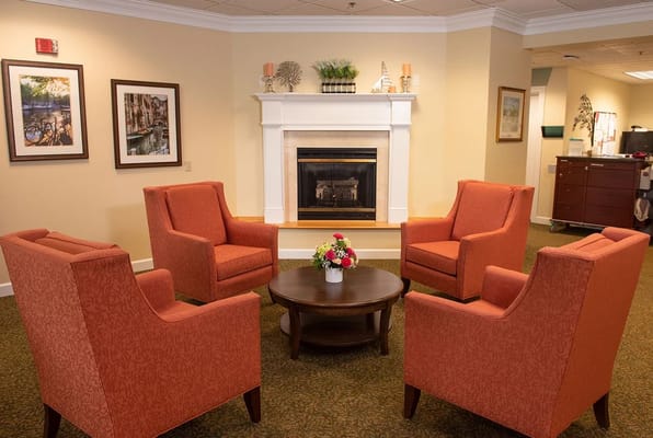 Common area with seating and fireplace