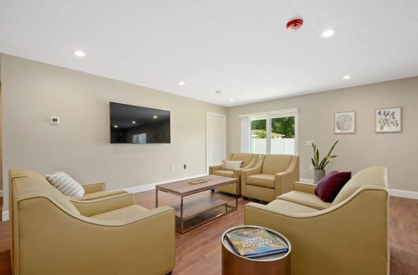 Bright common area with seating and natural light