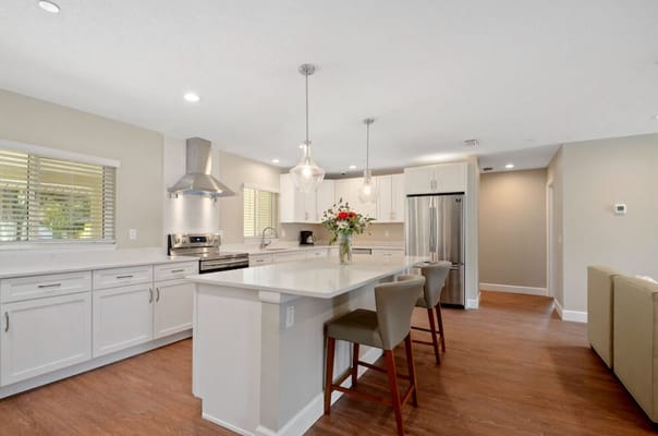 Bright, modern kitchen interior with island seating