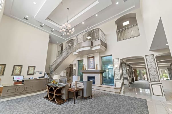 Elegant lobby area with staircase and seating