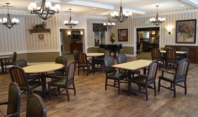 Spacious common area with tables and chairs