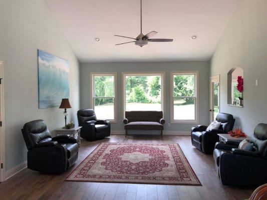 Bright common area with comfortable seating and large windows